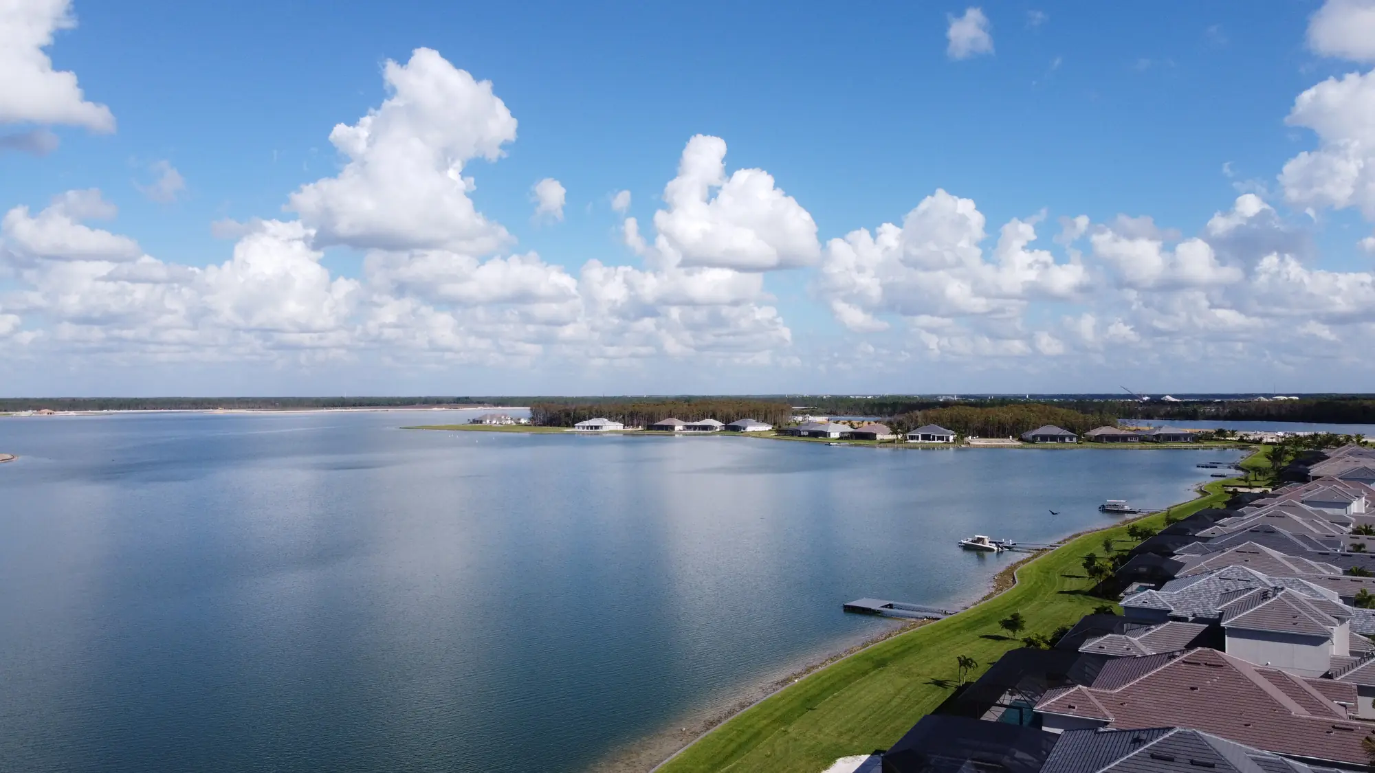 Lakefront homes along WildBlue Lake under a clear sky